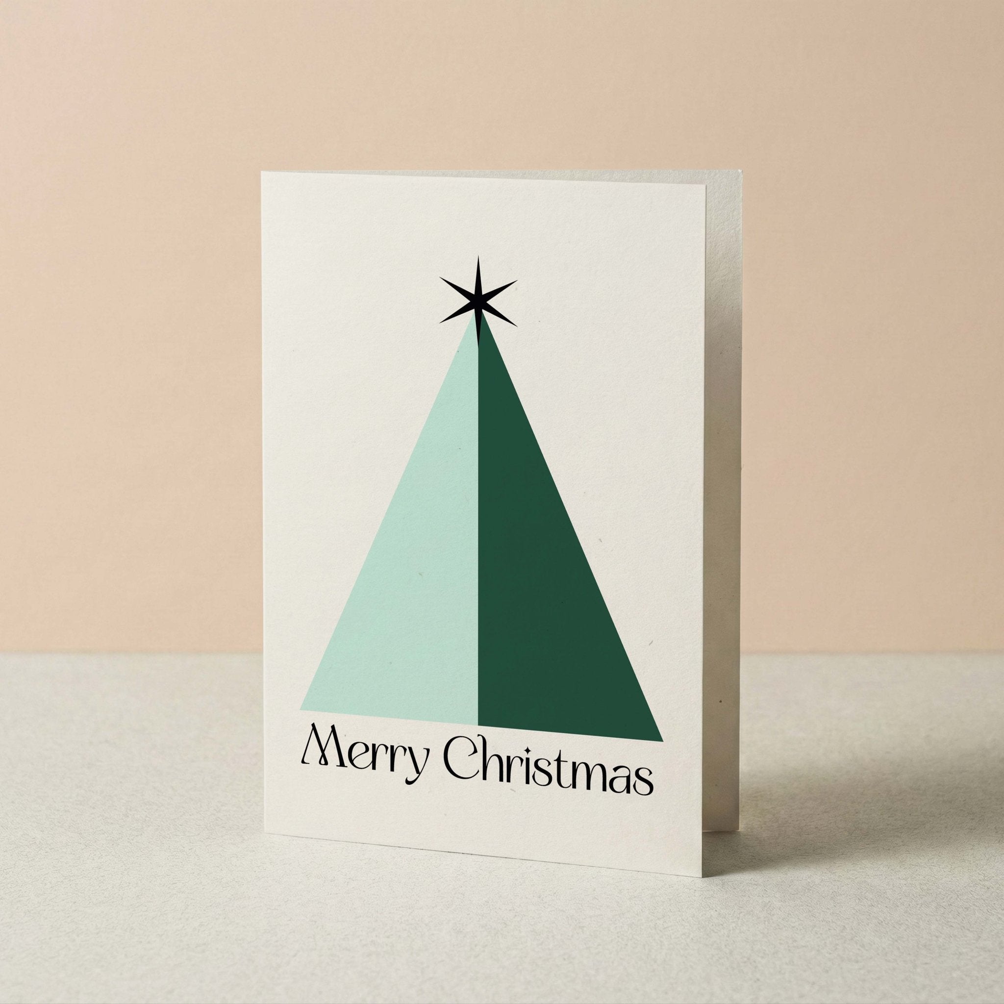Geo Christmas Tree Merry Christmas card by Blú Rose standing upright, geometric tree design on a neutral background