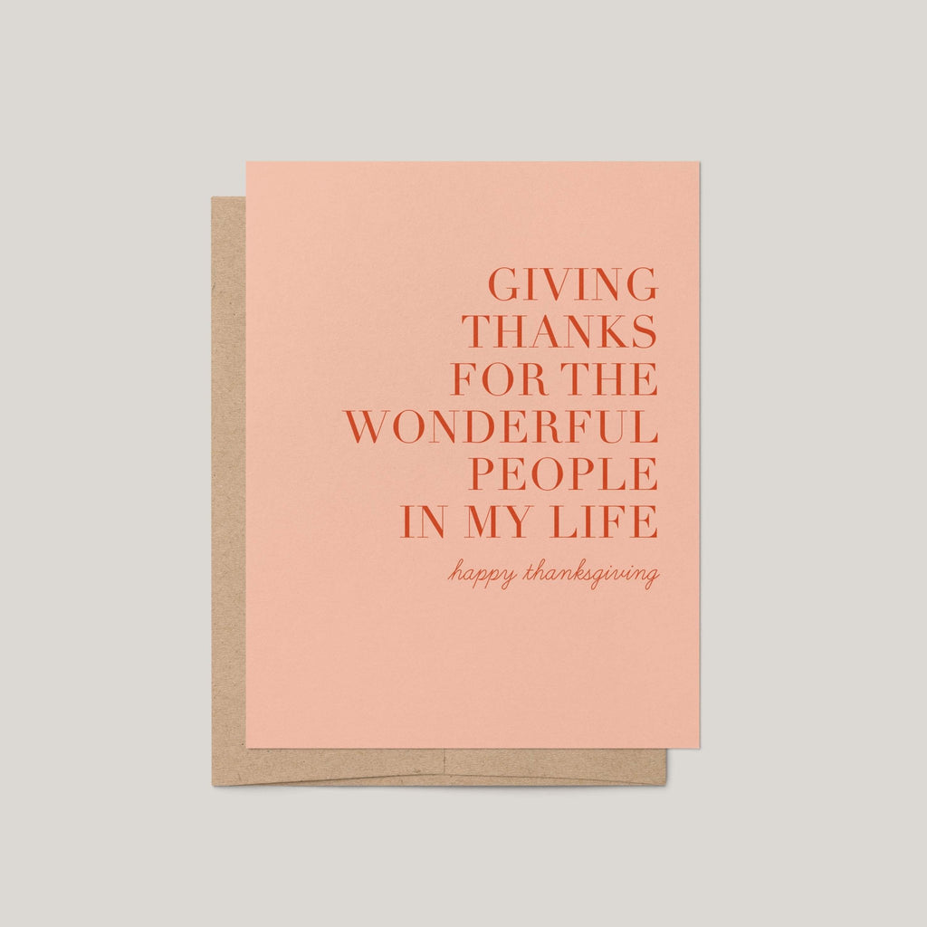 Giving Thanks Thanksgiving greeting card by Blú Rose, blush card with terracotta serif gratitude message, shown with kraft envelope