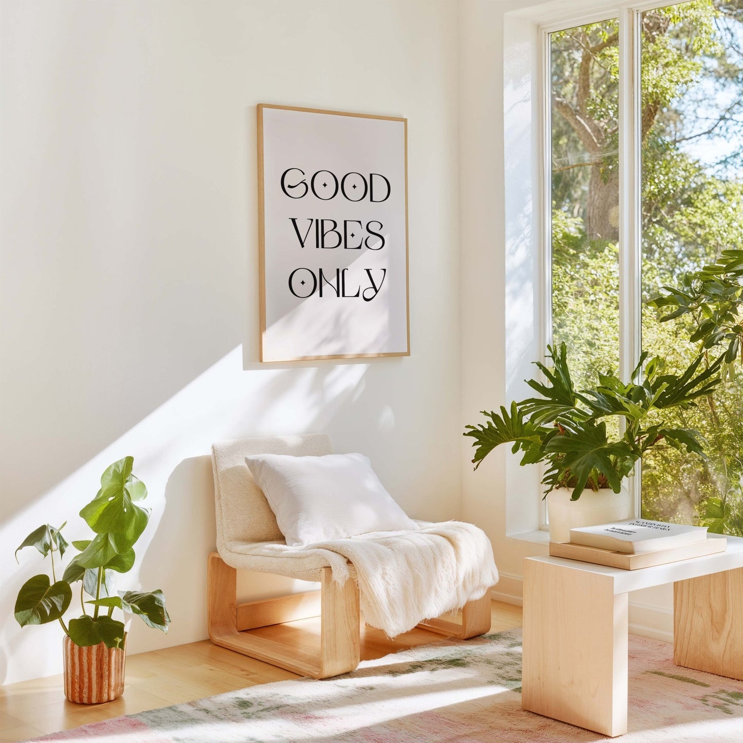 Good Vibes Only modern typography art print displayed in bright living room with plants and neutral decor