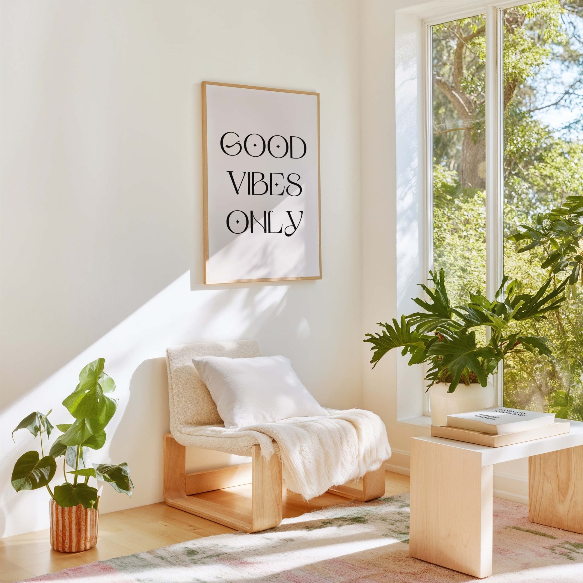 Good Vibes Only modern typography art print displayed in bright living room with plants and neutral decor