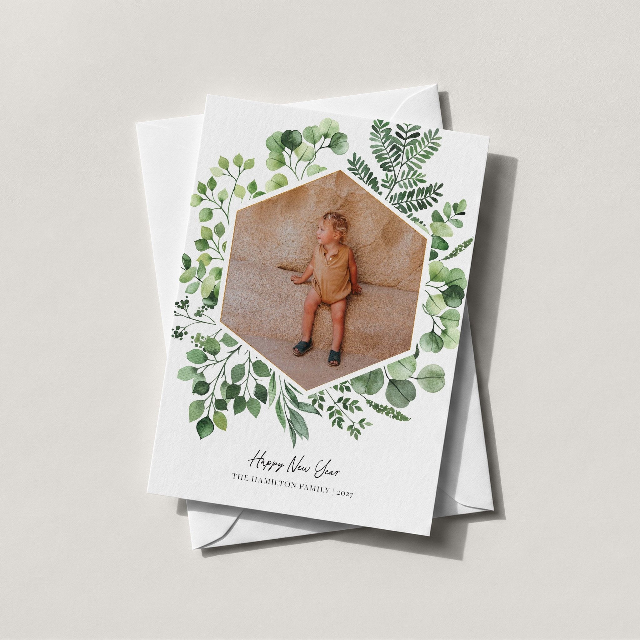 Greenery Frame photo card with a watercolor eucalyptus wreath framing a hexagon family photo