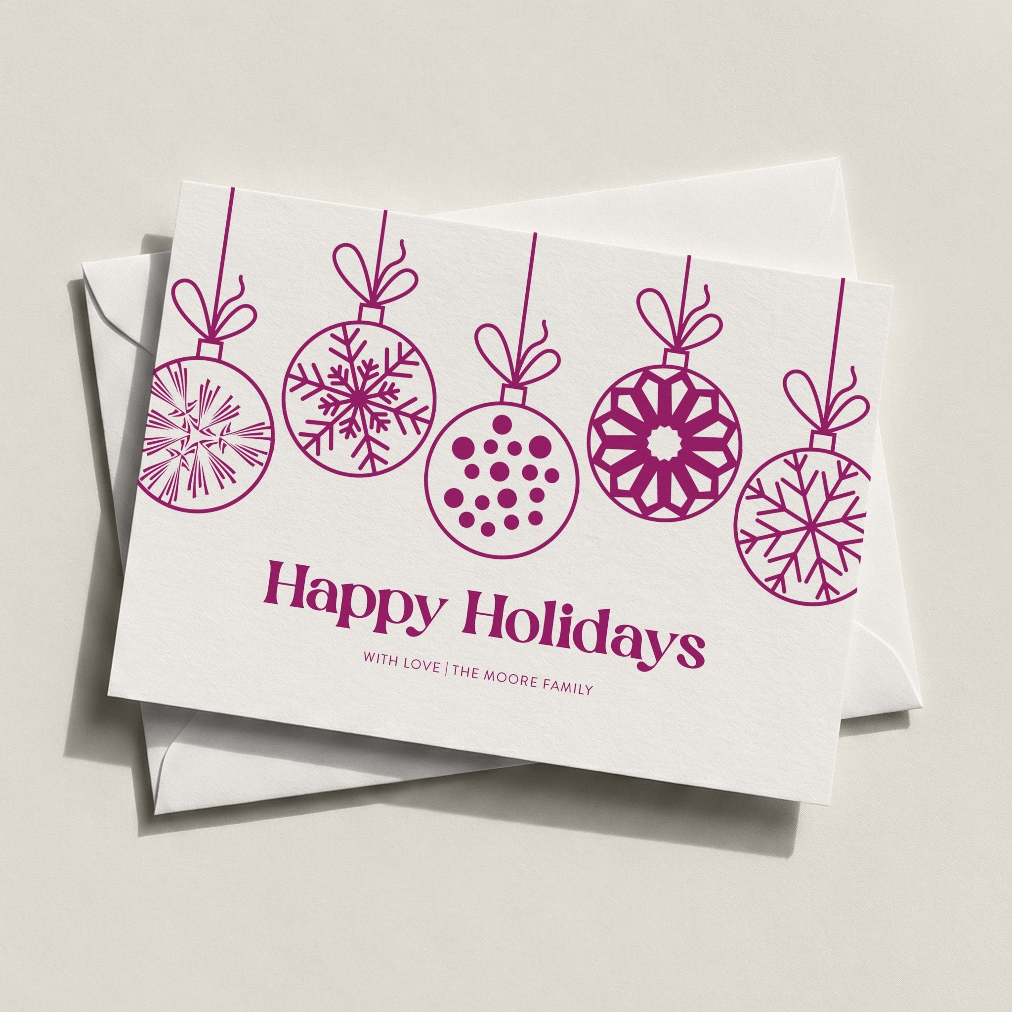Hanging Ornaments landscape card with magenta line-drawn ornaments and Happy Holidays script