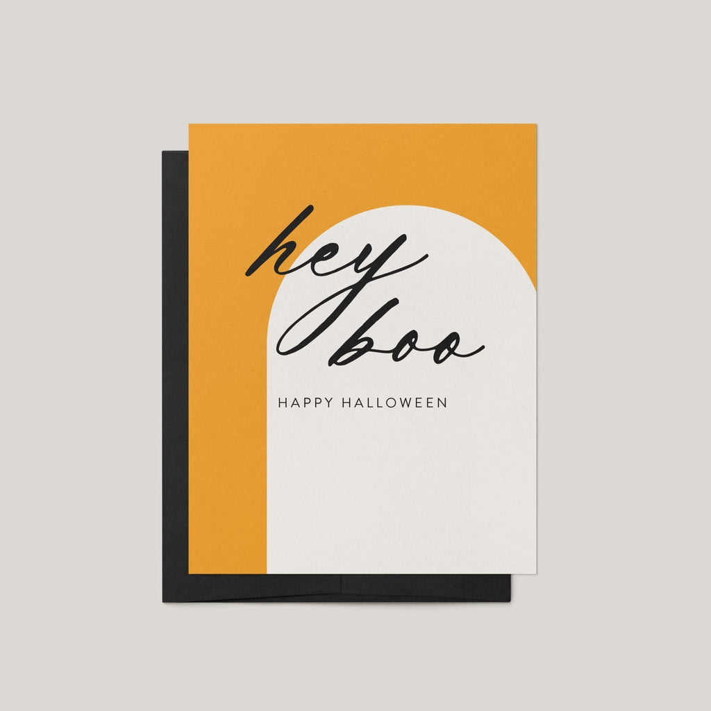 Hey Boo Halloween greeting card by Blú Rose, marigold and white arch card with black script hey boo text, shown with black envelope