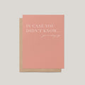 A pink greeting card with white text reading 'IN CASE YOU DIDN'T KNOW... you're amazing.