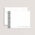 Leopard personalized notecards by Blú Rose, white flat notecard with a black-and-white leopard print side stripe and 'from the desk of Caitlyn Davis', shown with a coordinating white envelope