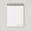 Leopard personalized notepad by Blú Rose, white notepad with a black-and-white leopard print top border and the name 'Caitlyn Davis'