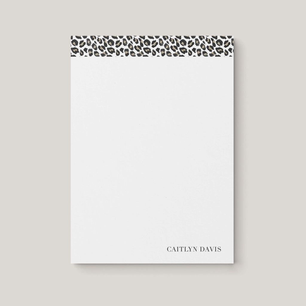 Leopard personalized notepad by Blú Rose, white notepad with a taupe leopard-print top border and the name 'Caitlyn Davis'