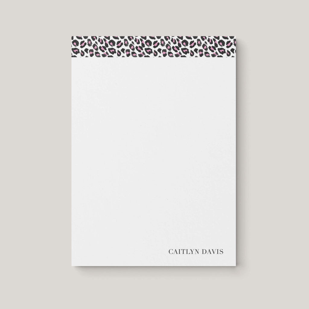 Leopard personalized notepad by Blú Rose, white notepad with a pink leopard-print top border and the name 'Caitlyn Davis'