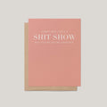 Life's A Shit Show funny encouragement greeting card by Blú Rose, mauve pink card with white serif text, shown with kraft envelope