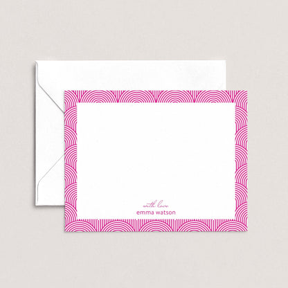 a white envelope with a pink frame and a blank white card with a pink border.
