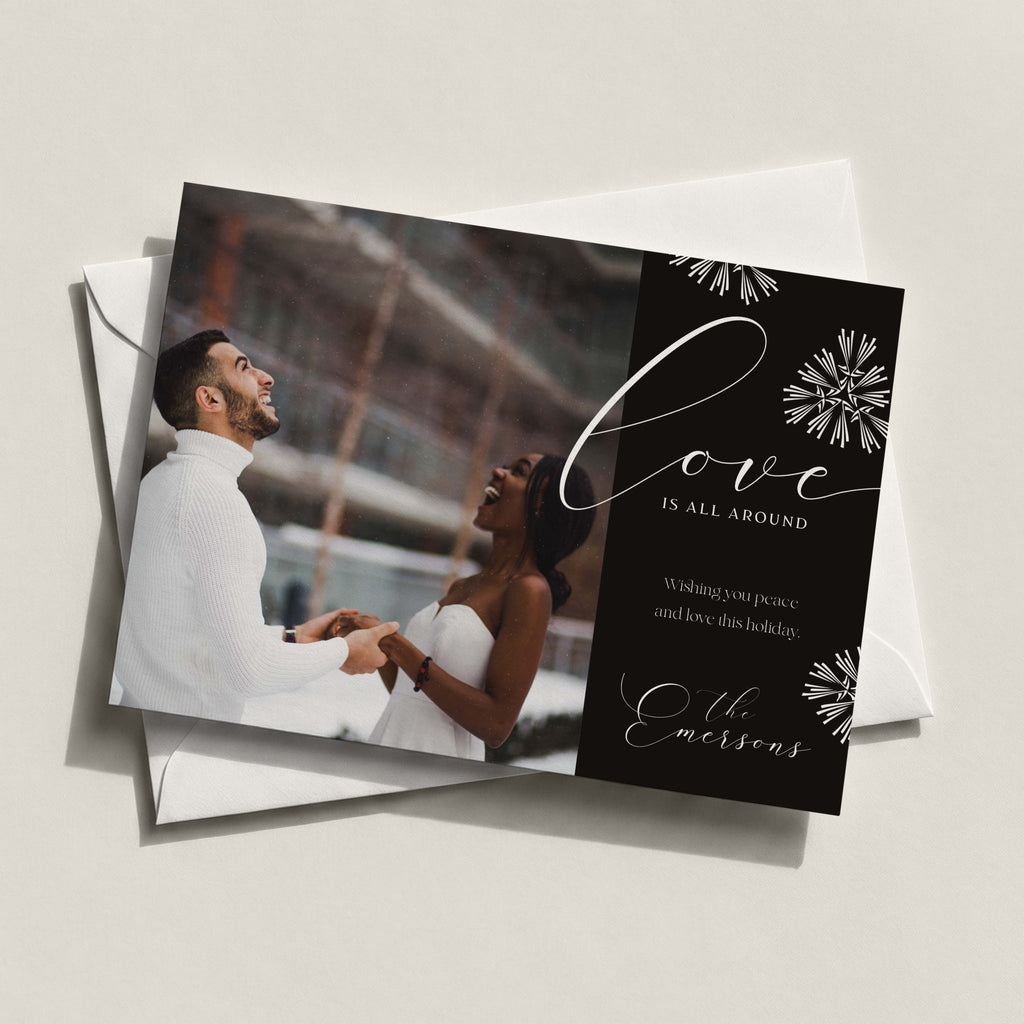 Love Is All Around landscape card in charcoal with a couple's photo, snowflakes and Love in script