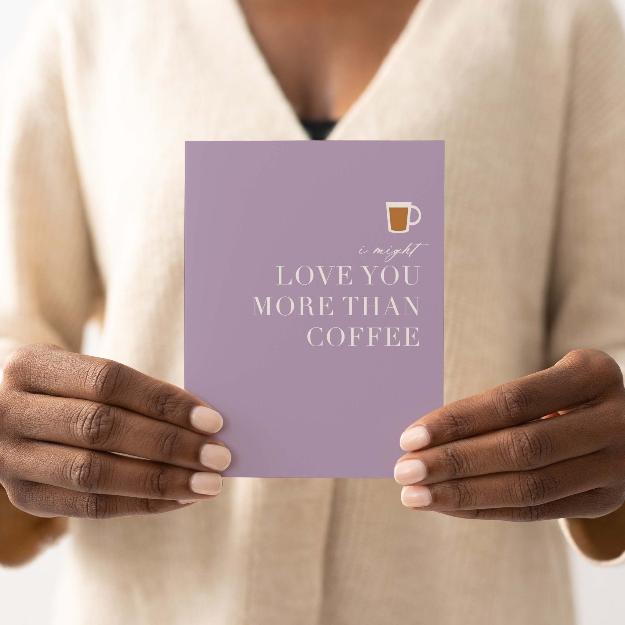 Love You More Than Coffee card by Blú Rose held in both hands by a person in a cream sweater