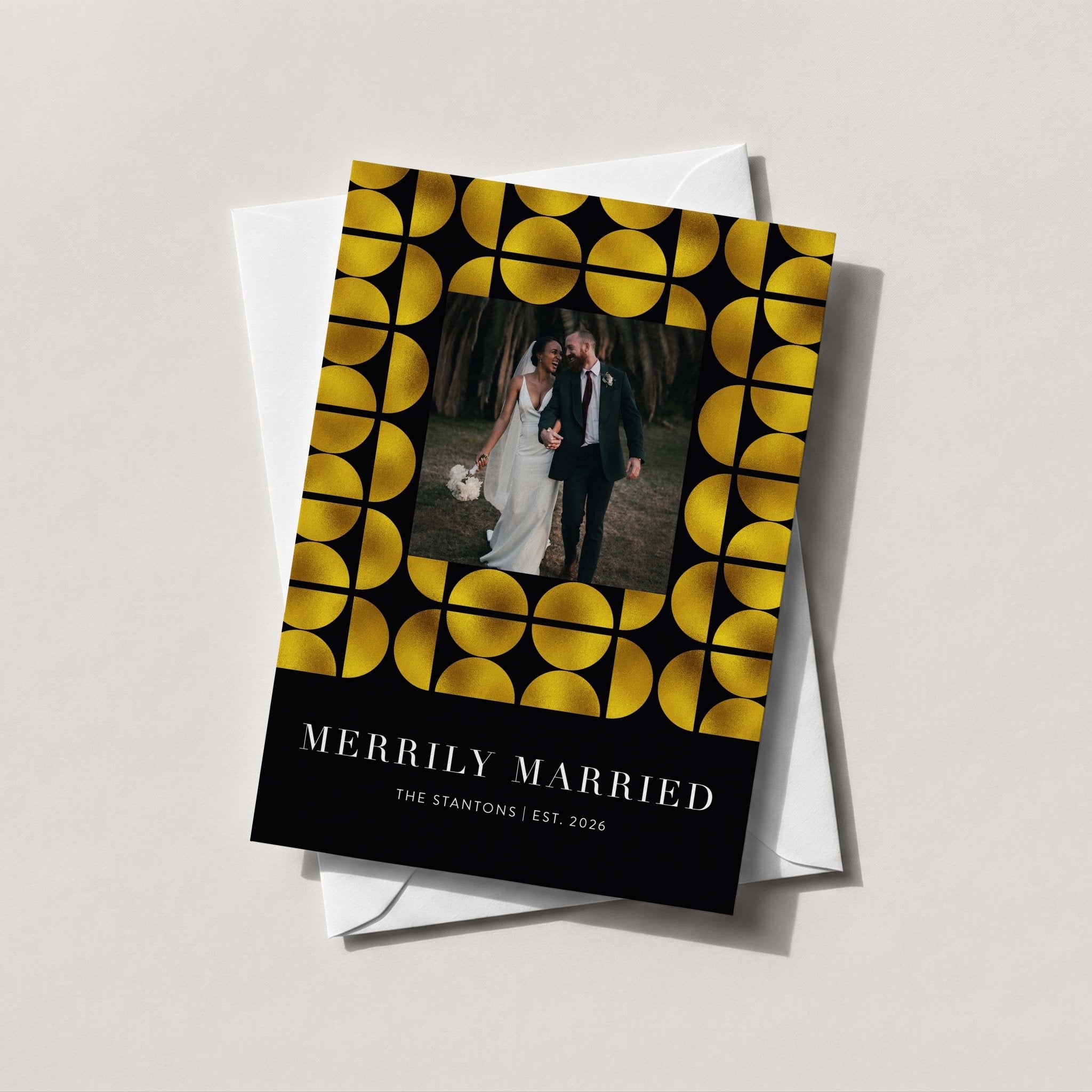 Merrily Married photo card with a gold foil geometric border framing a wedding photo