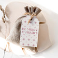 Merry & Bright gift tag by Blú Rose, cream 'Be Merry & Bright' tag with burgundy stars on a burlap favor bag