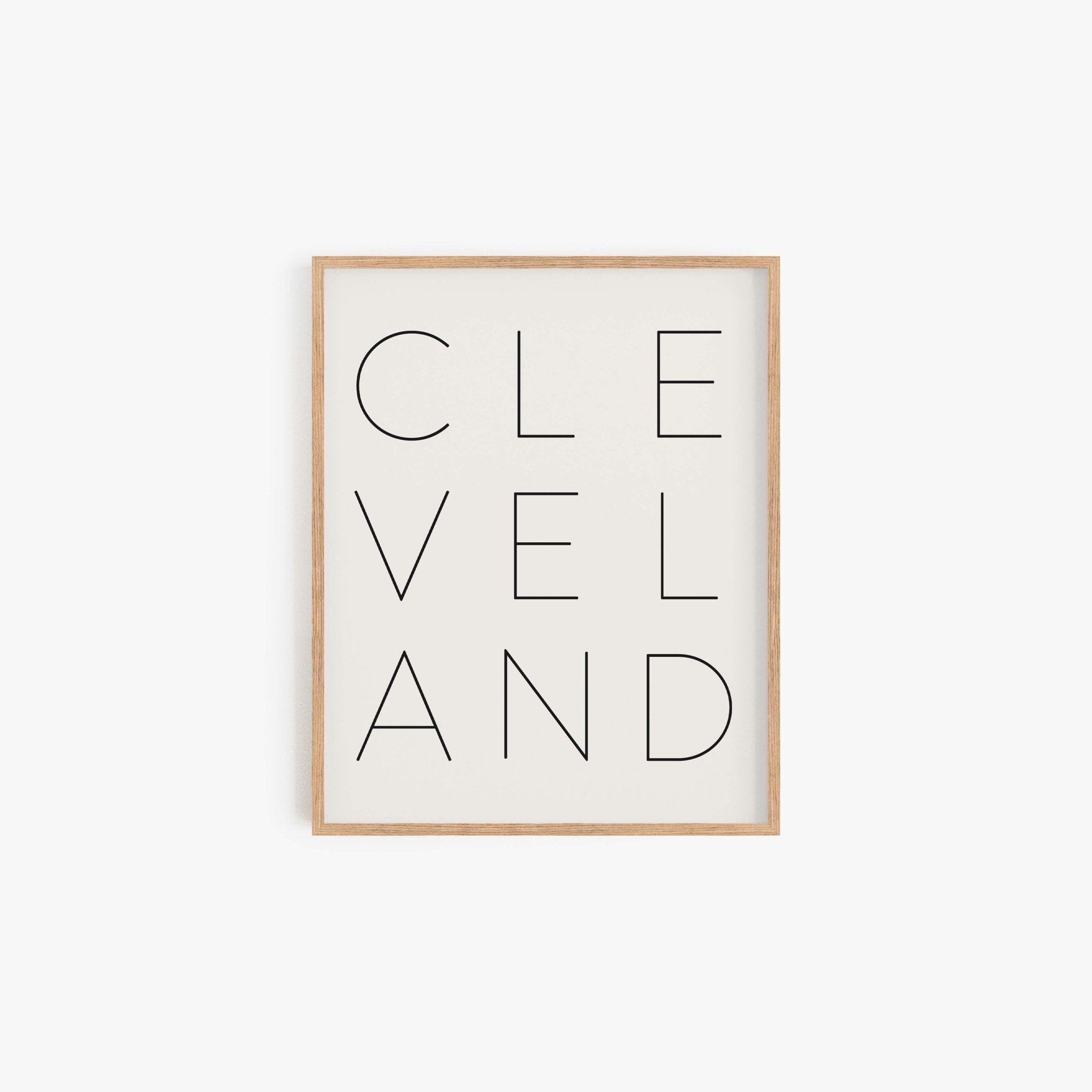 Minimalist Cleveland art print with vertical typography design on off-white background