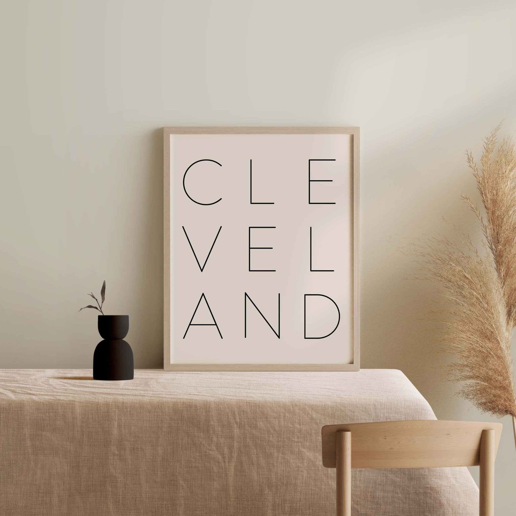 Minimalist Cleveland quote art print styled on neutral console table with decor