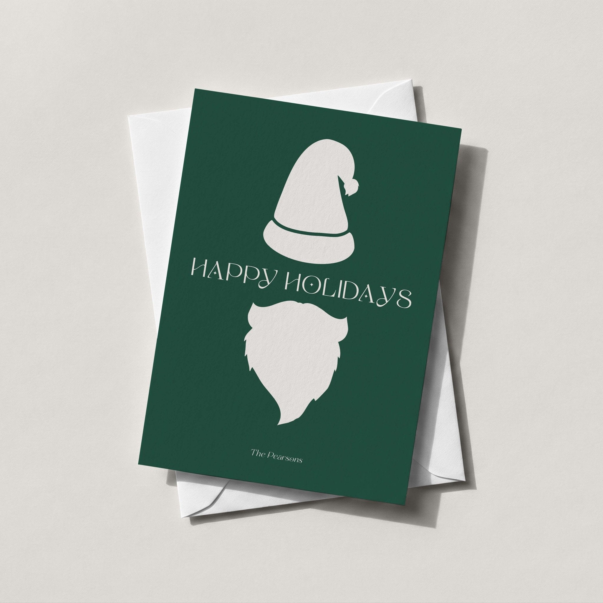 Minimalist Santa card in forest green with a white Santa silhouette and HAPPY HOLIDAYS