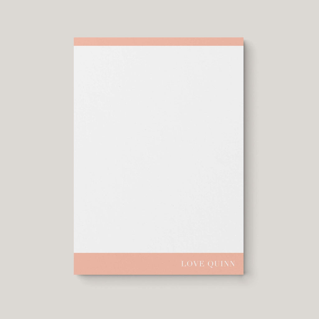 Mod Border personalized notepad by Blú Rose, white notepad with peach color-block borders and 'Love Quinn' in white