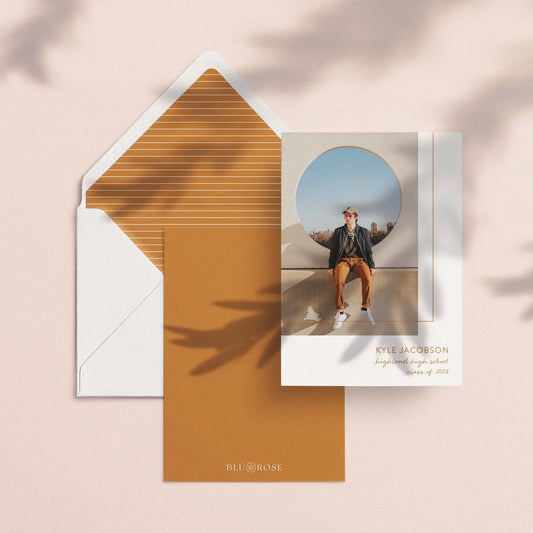 Mod Box graduation announcement card with photo shown alongside an envelope with striped liner and solid brown backer card