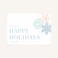 Modern snowflake holiday card with pastel snowflakes and “Happy Holidays” message on a clean neutral background.