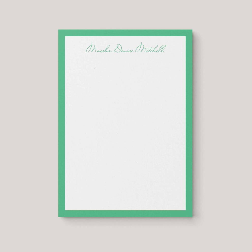 Moesha Border personalized notepad by Blú Rose, white notepad with a green border and the name 'Moesha Denise Mitchell' in green script