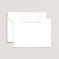 Moesha personalized notecards by Blú Rose, white flat notecard with the name 'Moesha Denise Mitchell' in green script, shown with a coordinating white envelope