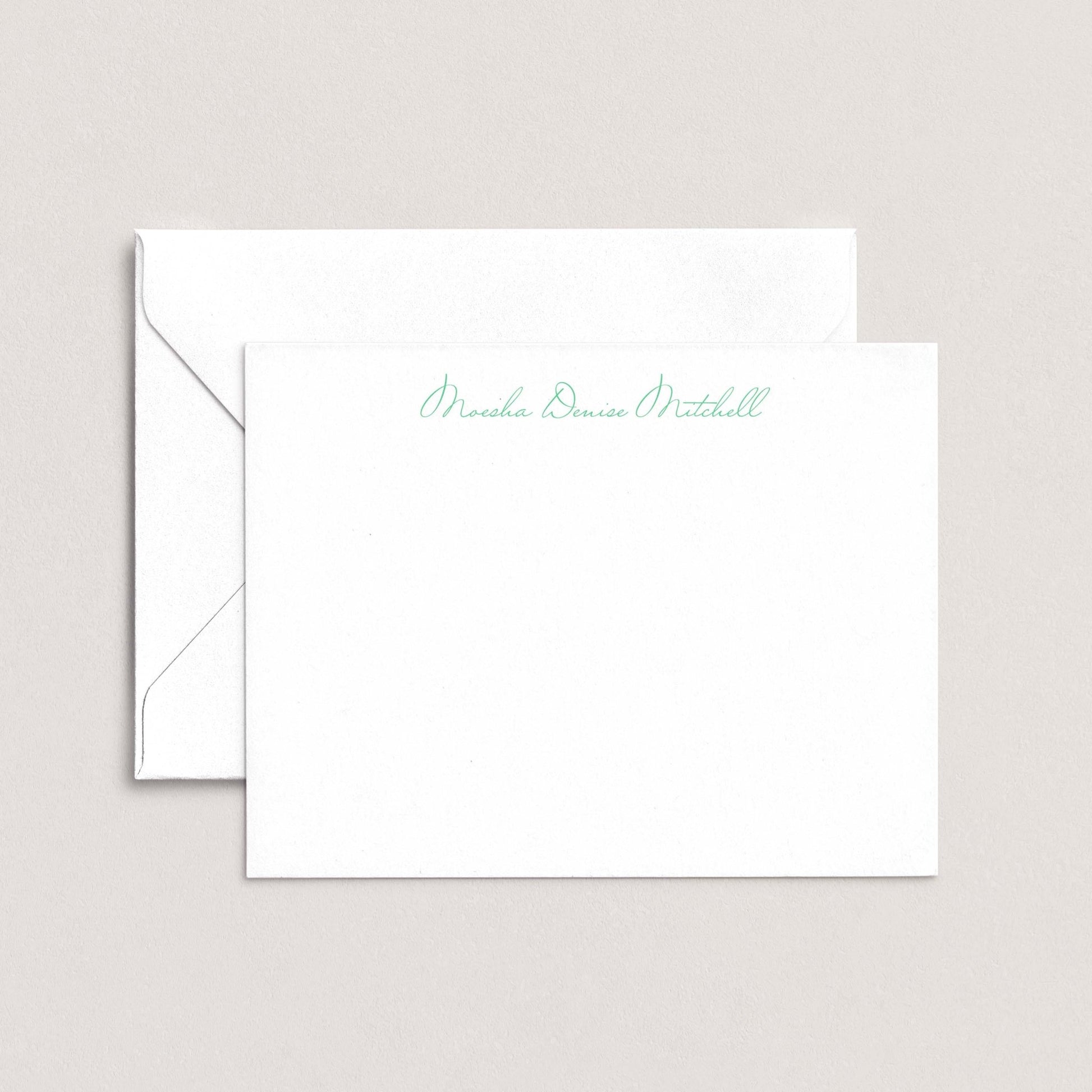A white envelope with a personalized note inside, placed on a plain background.