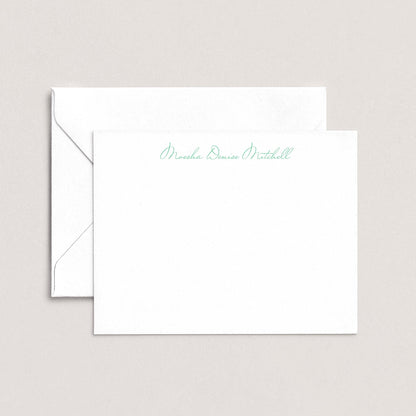 A white envelope with a personalized note inside, placed on a plain background.