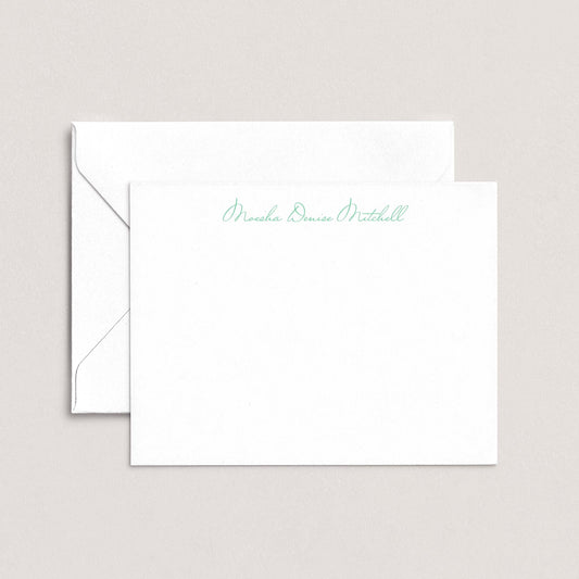 A white envelope with a personalized note inside, placed on a plain background.