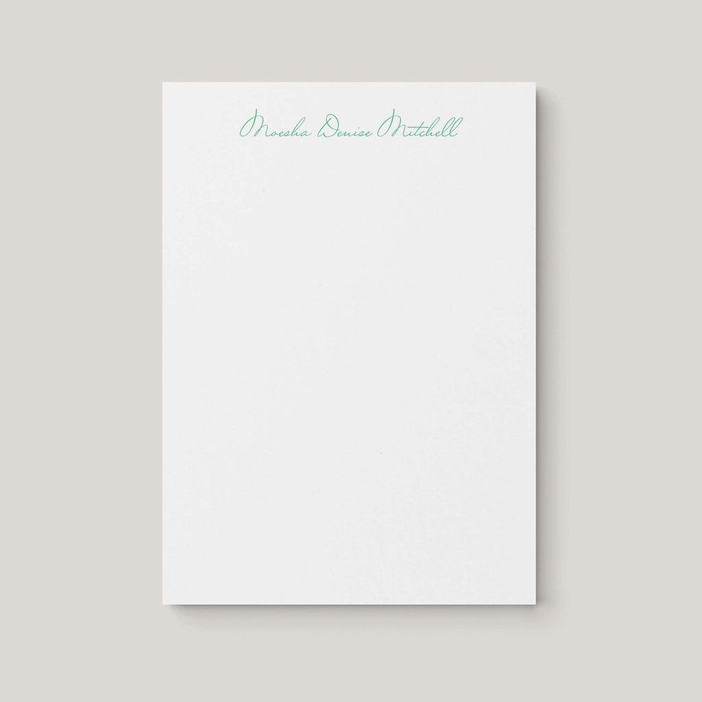 Moesha personalized notepad by Blú Rose, white notepad with the name 'Moesha Denise Mitchell' in green script