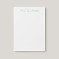 Moesha personalized notepad by Blú Rose, white notepad with the name 'Moesha Denise Mitchell' in green script