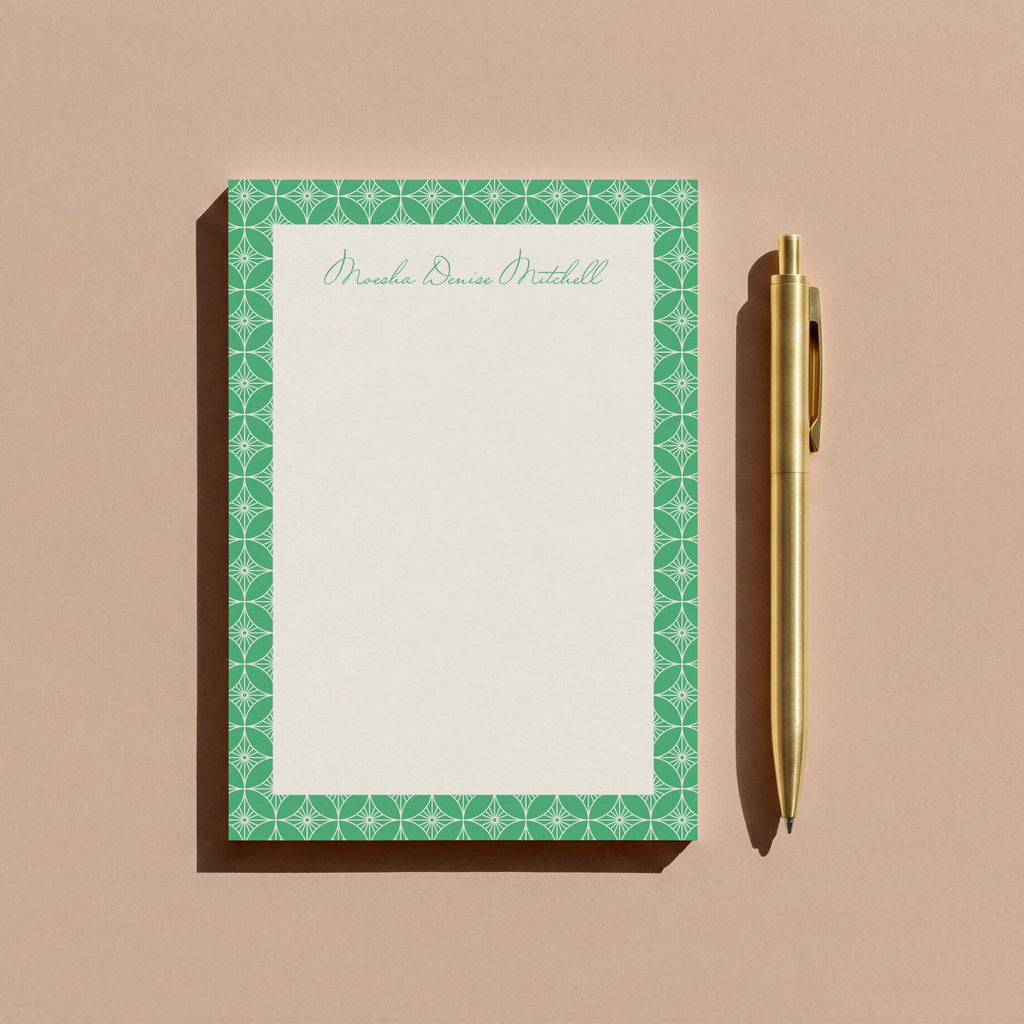 Moesha Pattern personalized notepad by Blú Rose, green-patterned notepad photographed with a gold pen on a mauve background