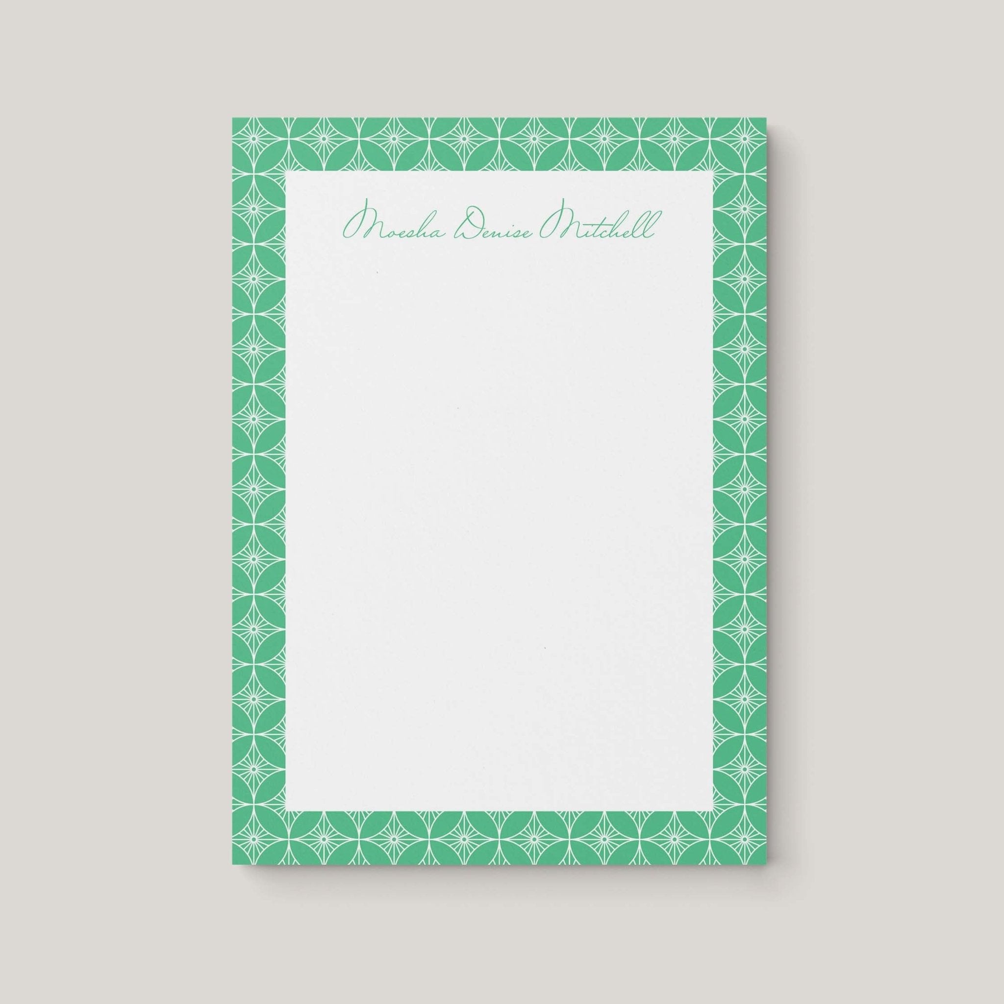 Moesha Pattern personalized notepad by Blú Rose, cream notepad with a green geometric-patterned border and the name 'Moesha Denise Mitchell' in green script