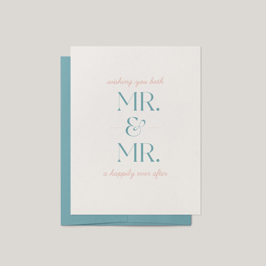 A wedding greeting card with a white front and a teal envelope behind it, printed with the words 'wishing you both MR. & MR. a happily ever after.