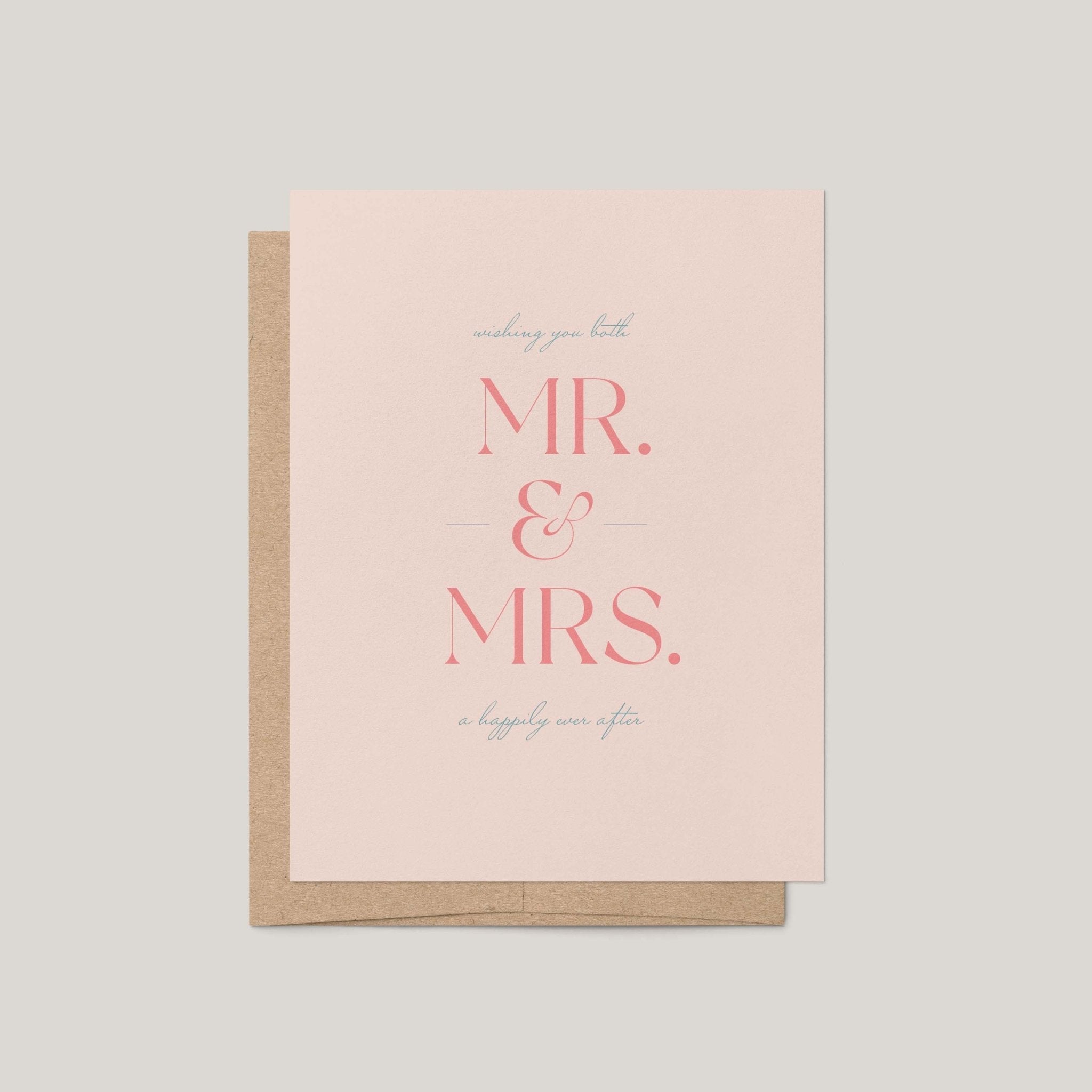 A blush pink greeting card with a kraft brown envelope, featuring the text 'wishing you both MR. & MRS. a happily ever after'