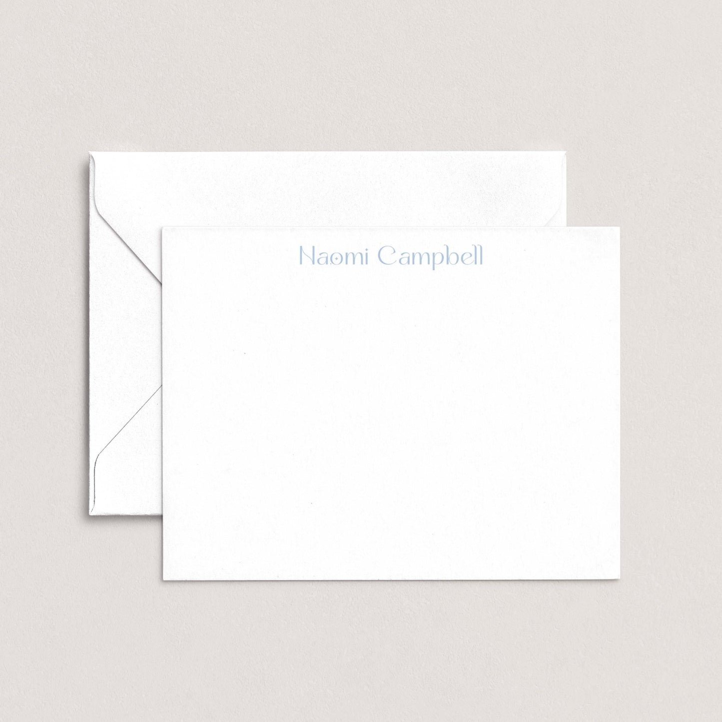 A white envelope with the name "Campbell" printed on it, placed on top of a plain white background.