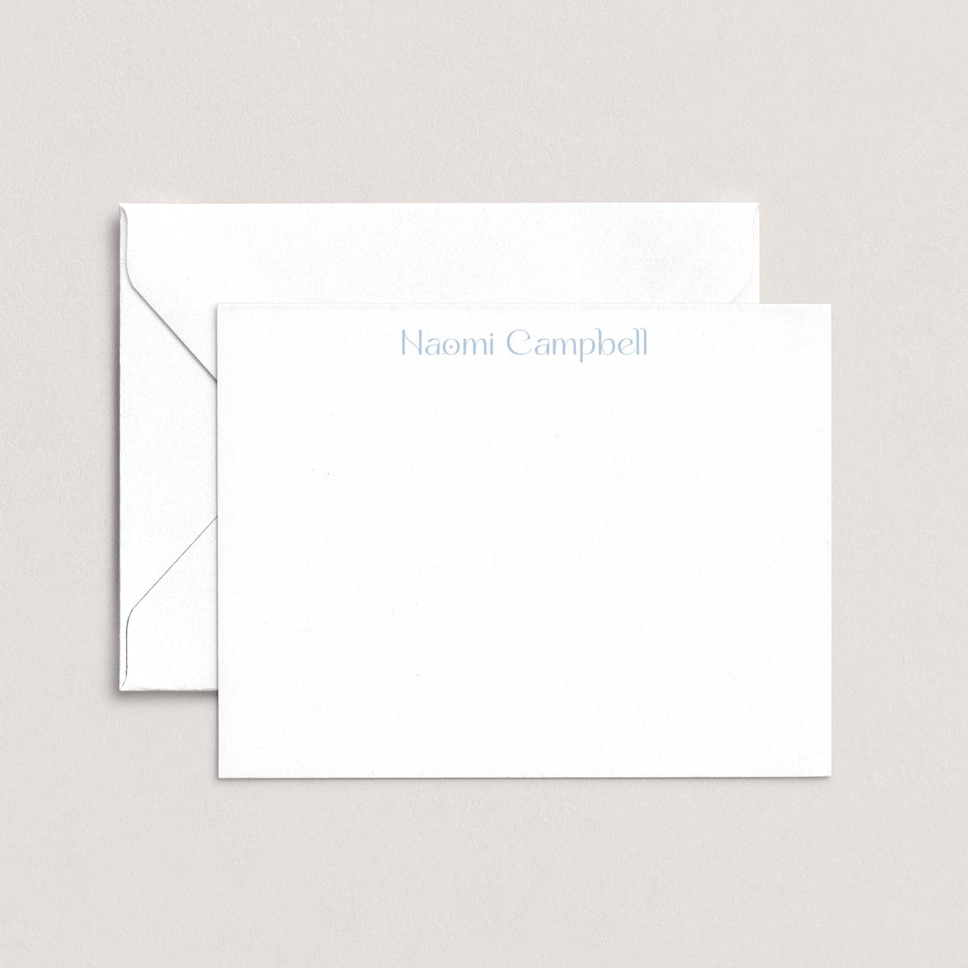 A white envelope with the name "Campbell" printed on it, placed on top of a plain white background.
