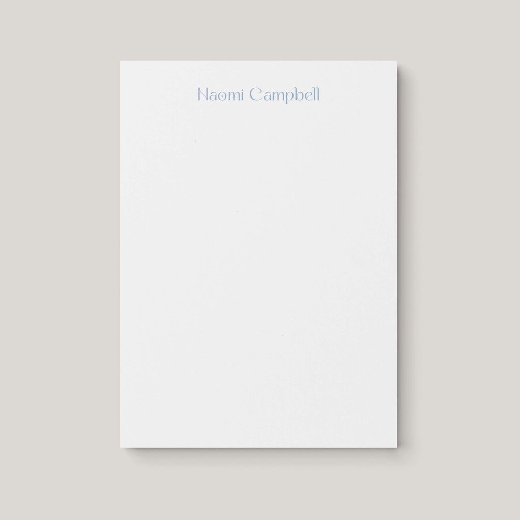 Naomi personalized notepad by Blú Rose, white notepad with the name 'Naomi Campbell' in dusty blue