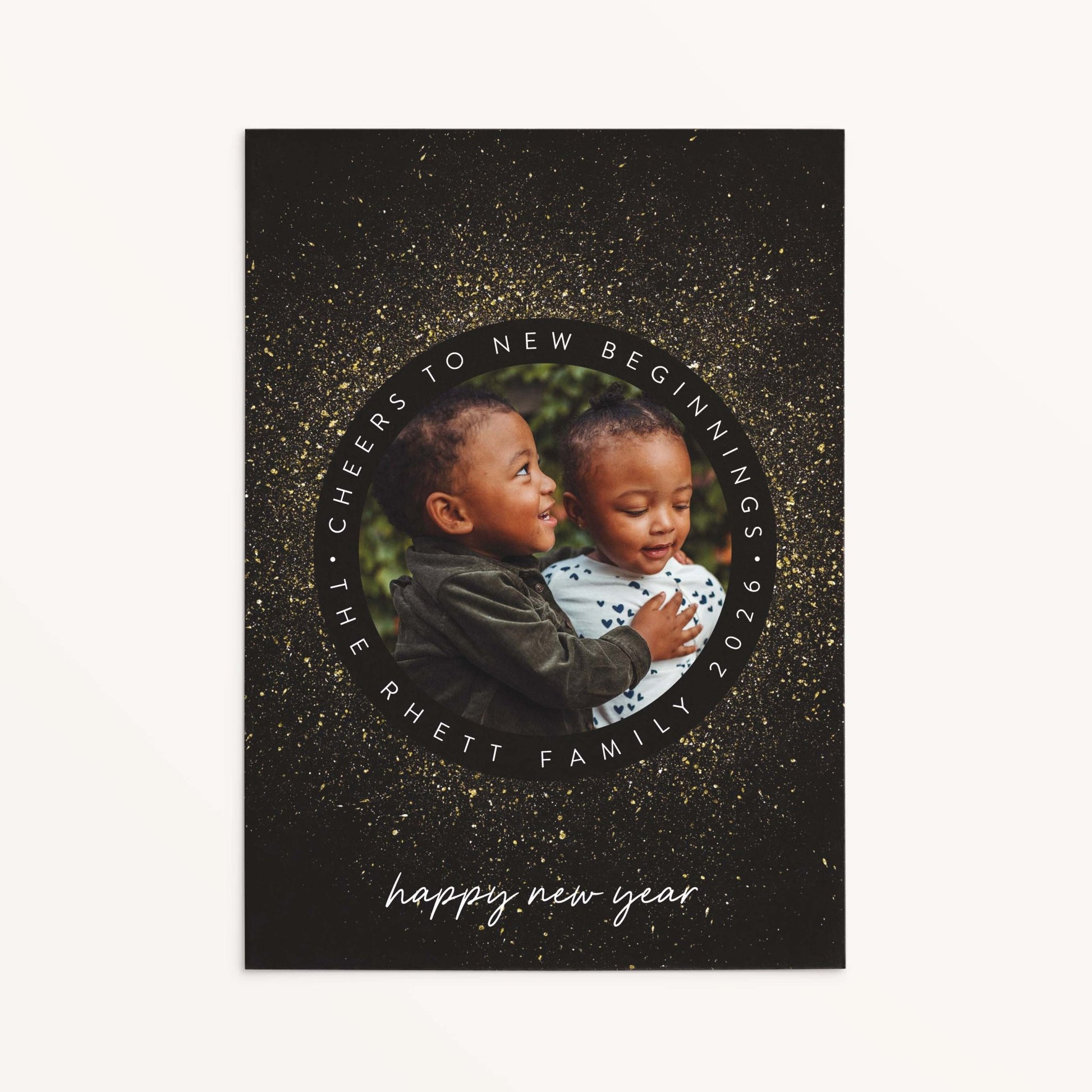 Personalized New Year Sparkle holiday photo card with circular frame, faux gold sparkle details, and black background