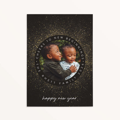 Personalized New Year Sparkle holiday photo card with circular frame, faux gold sparkle details, and black background