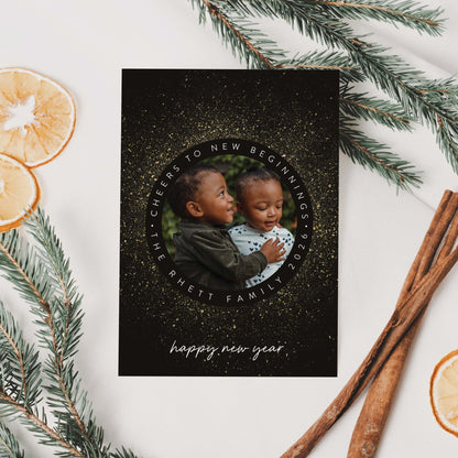 New Year Sparkle holiday photo card styled with greenery and citrus accents