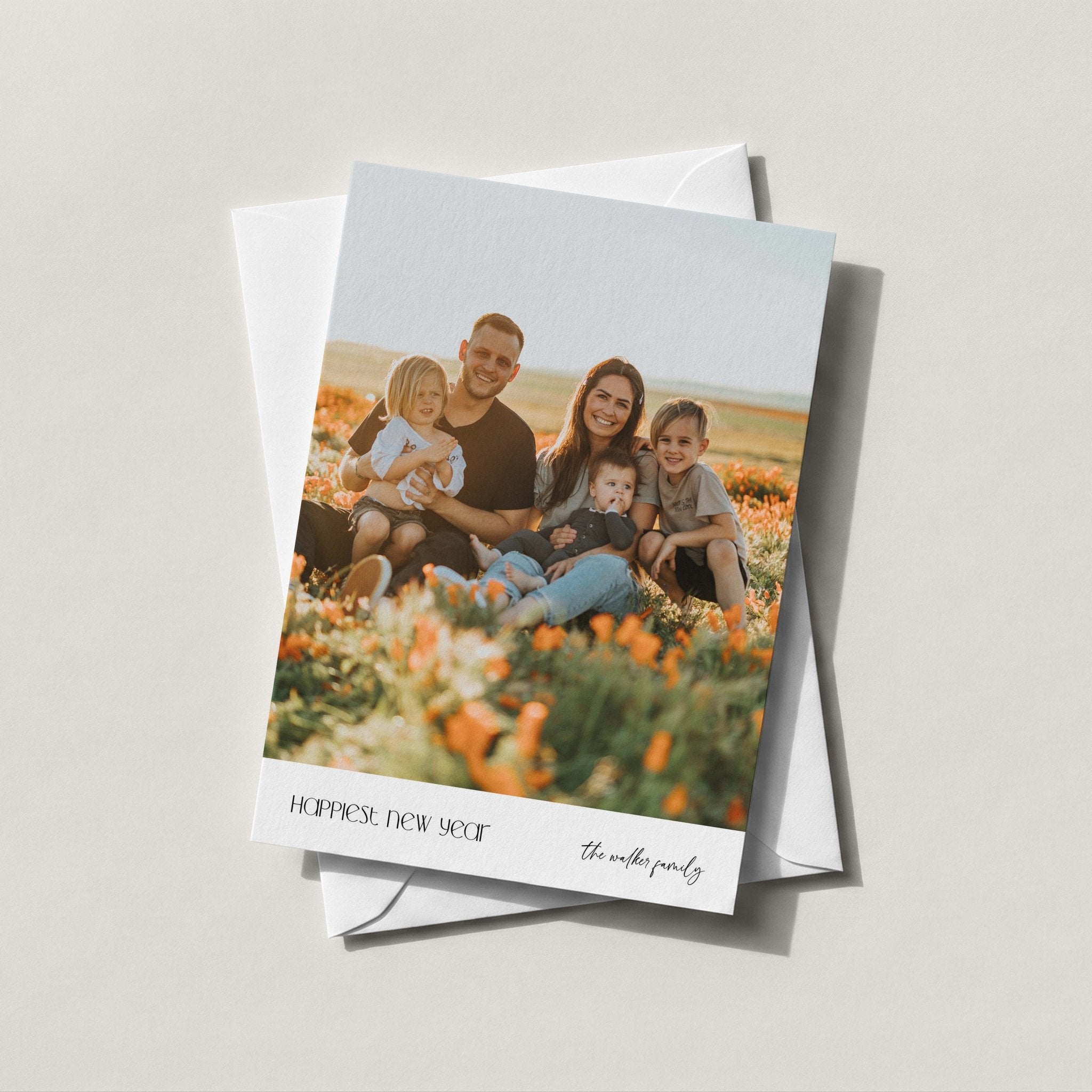 On the Edge photo card with a full-bleed family photo and a slim golden yellow border