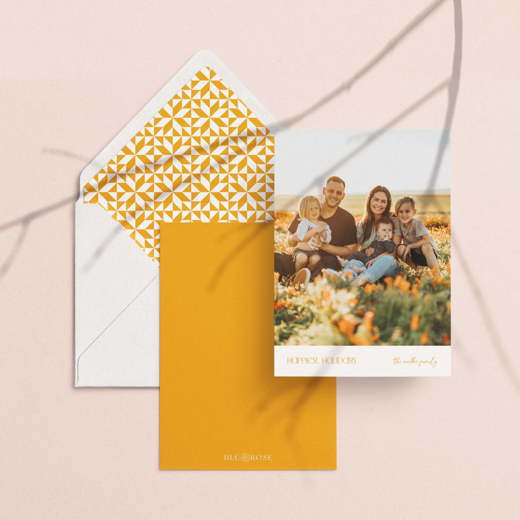 On the Edge card with its golden lattice-print envelope liner styled on a blush backdrop