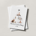 Photo Tree card arranging six family photos into a Christmas tree with Merry Everything script
