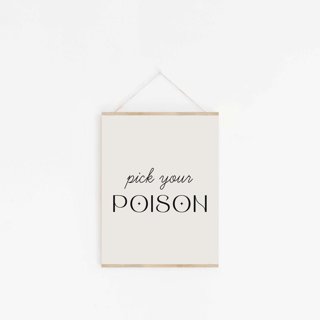 Pick Your Poison quote art print hanging from wooden hanger on off-white background