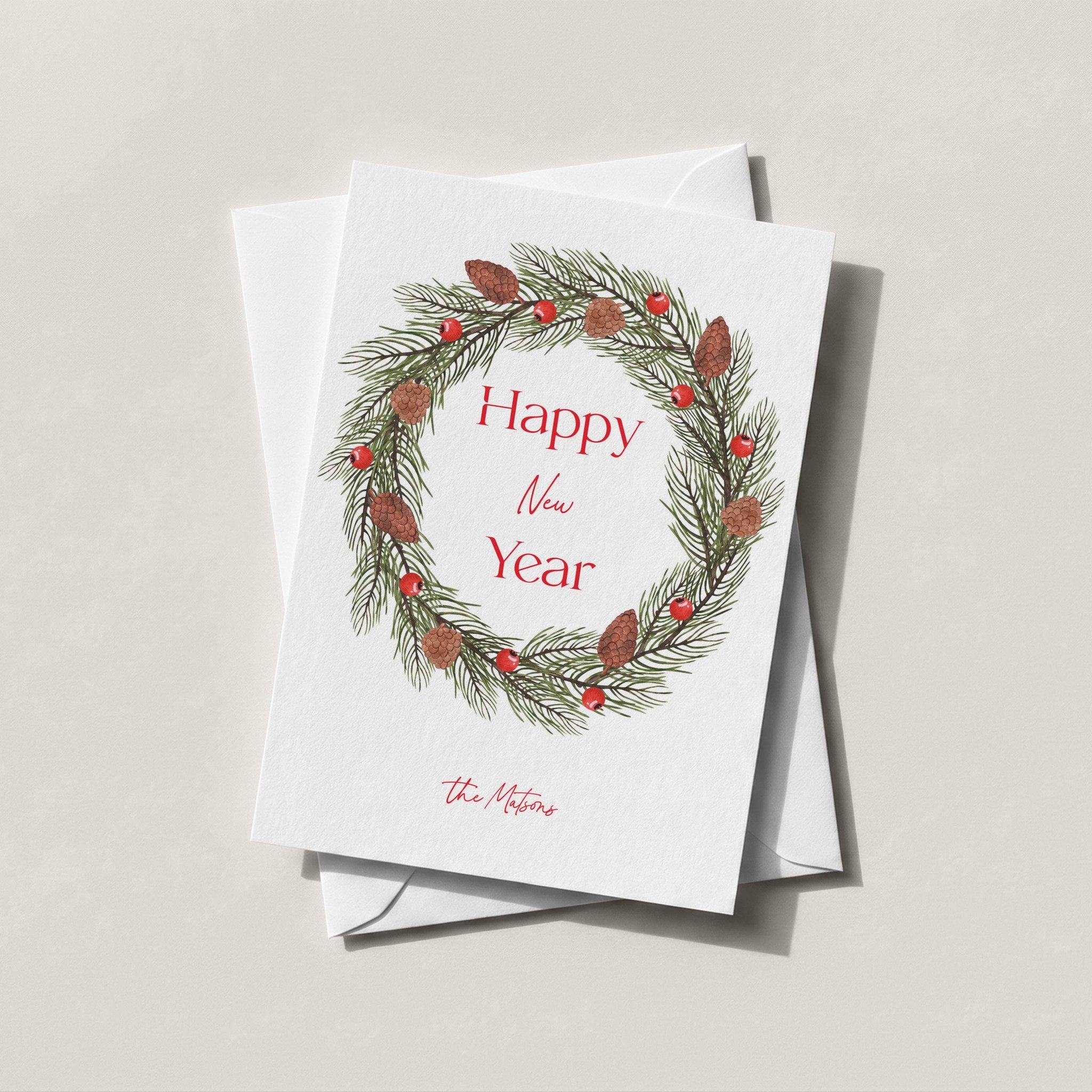 Pinecone Berry Wreath card with a red berry and pine wreath around Happy New Year script