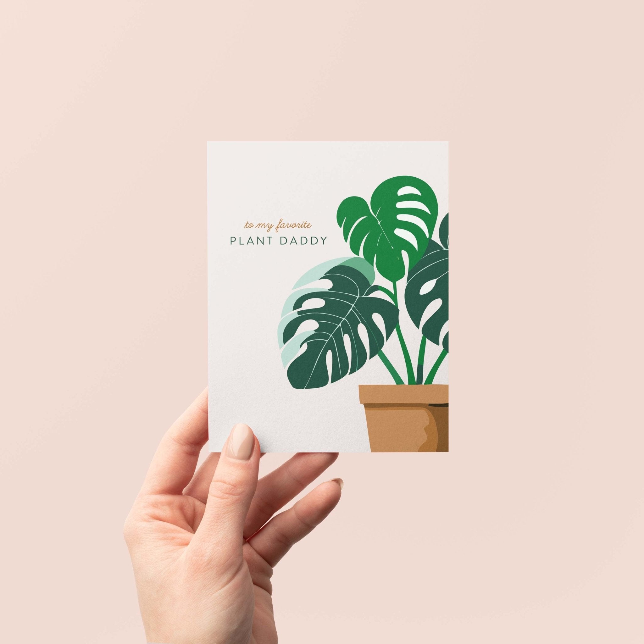 Plant Daddy greeting card by Blú Rose held in hand against a neutral off-white background