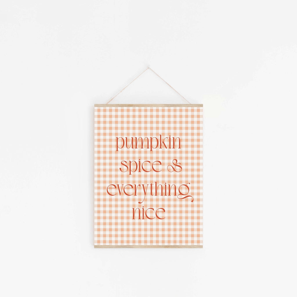 Minimalist pumpkin spice autumn typography print hanging from wooden hanger