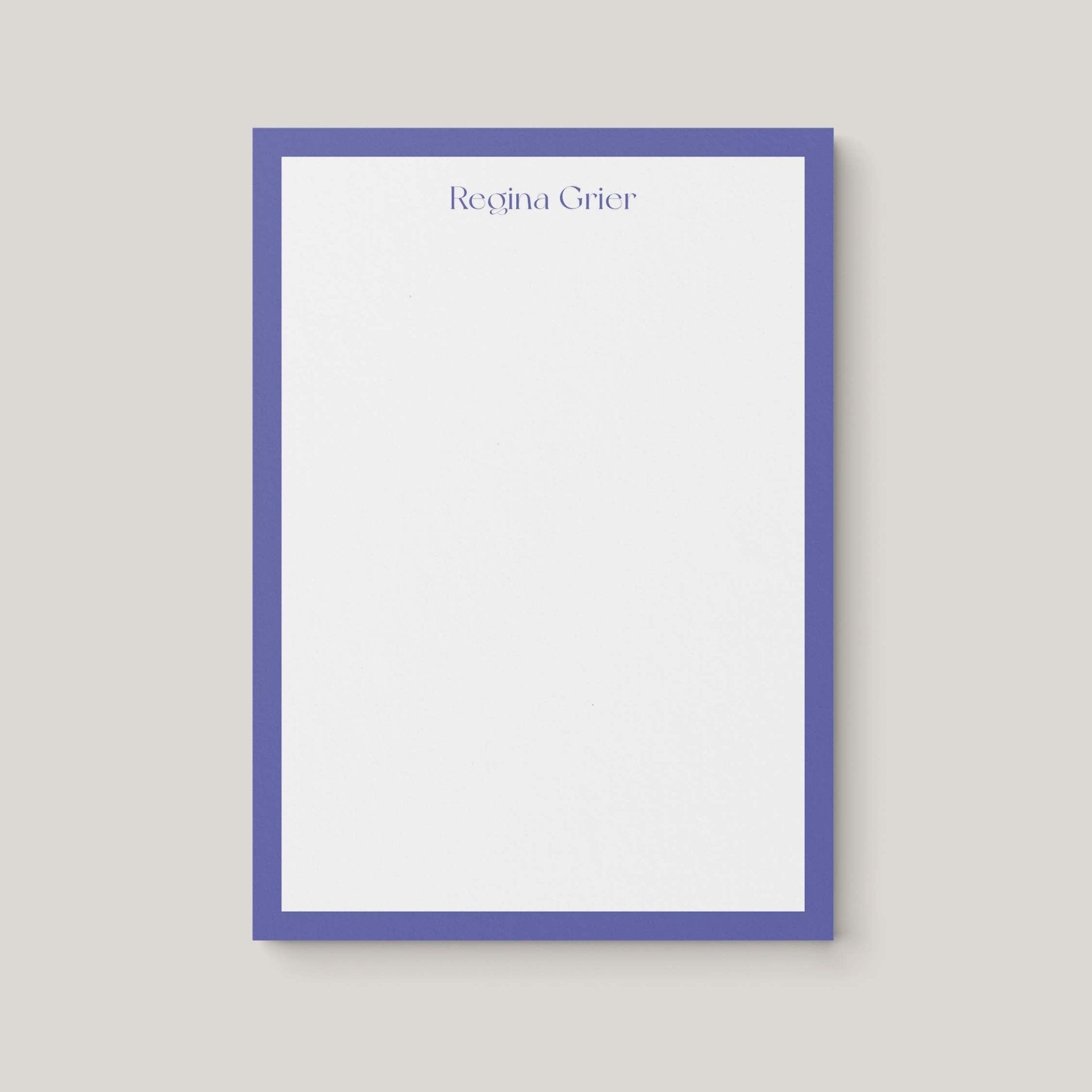 Regina Border personalized notepad by Blú Rose, white notepad with a periwinkle border and the name 'Regina Grier'