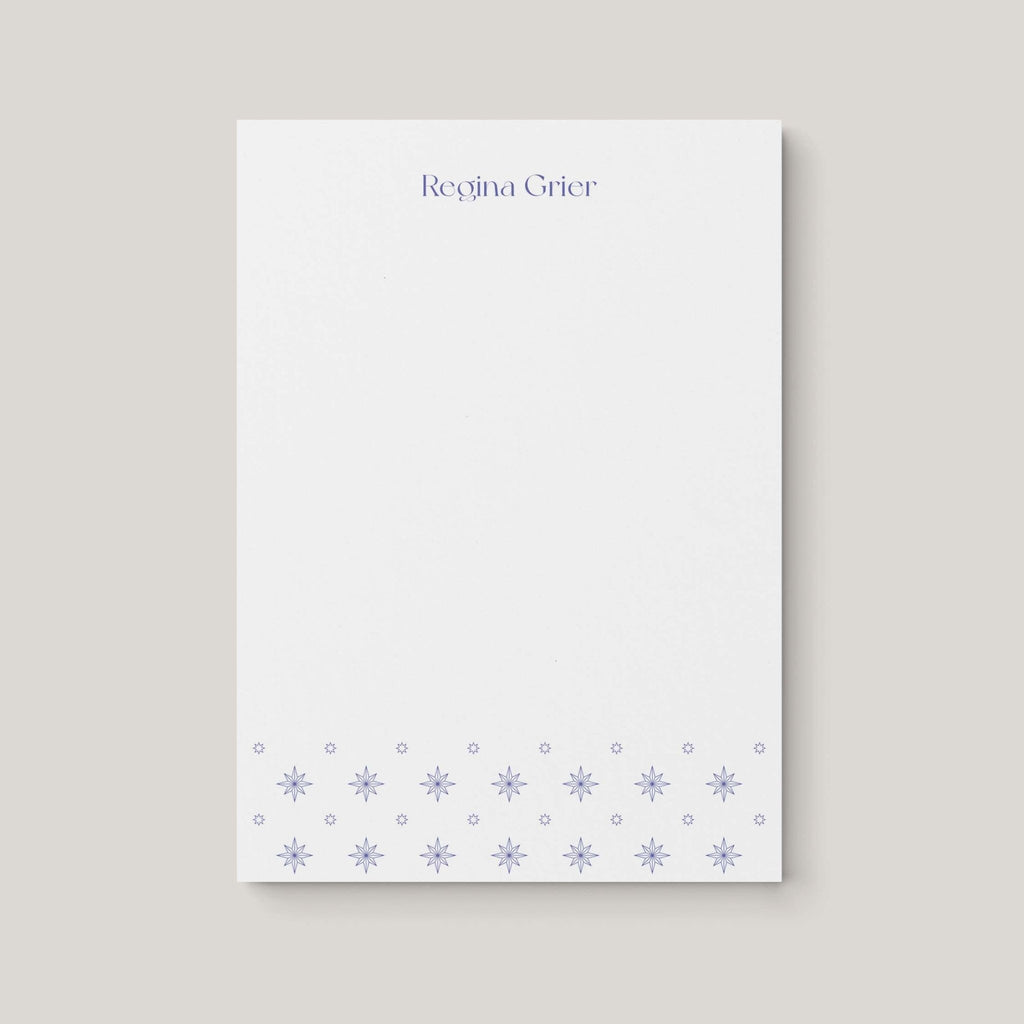 Regina Pattern personalized notepad by Blú Rose, white notepad with the name 'Regina Grier' in periwinkle and a periwinkle starburst border